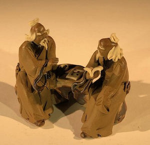 Ceramic Figurine-Two Mud Men Sitting On A Bench Reading Books - 2.5-