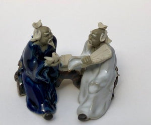 Ceramic Figurine-Two Men Sitting On A Bench Holding Fan & Pipe- 2.25-Color: Blue & White